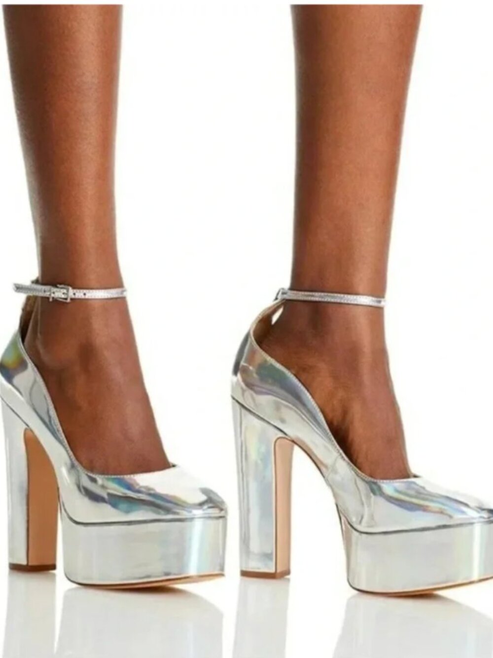 Schutz Renee holographic silver platform pumps in women’s size 7B.